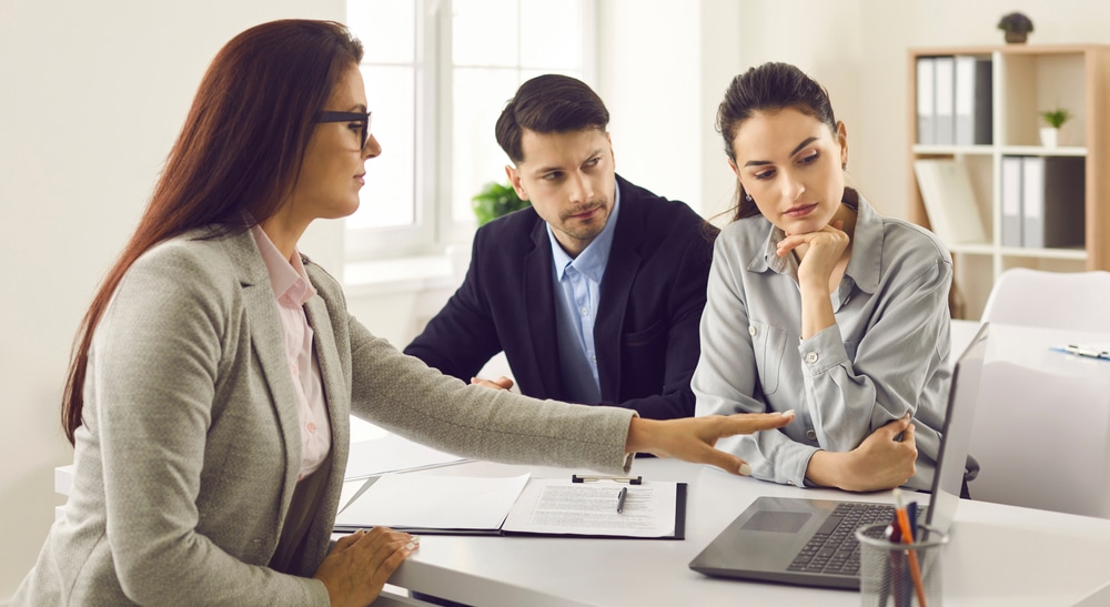 Office,Meeting,With,Real,Estate,Agent.,Couple,Of,Serious,Future